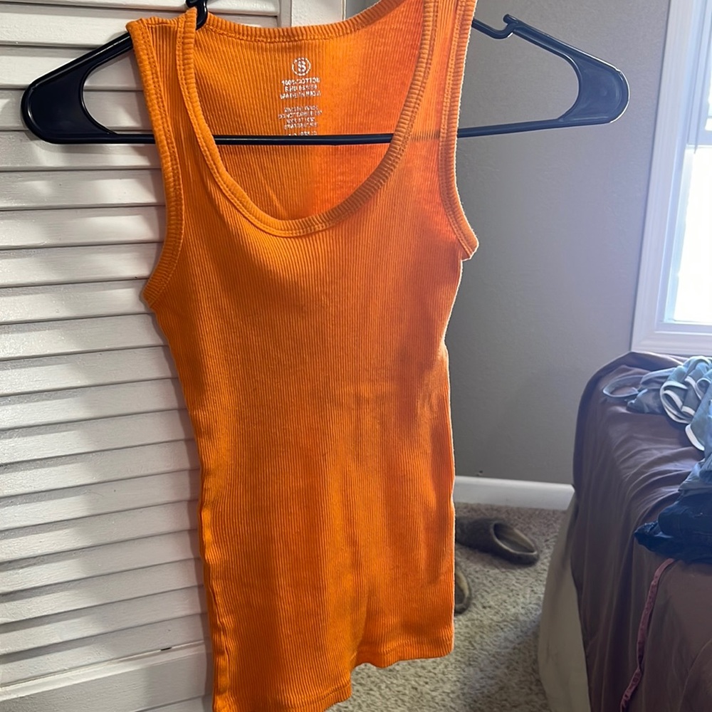 Orange muscle tank. Size small, no brand. Super super stretchy and comfy.